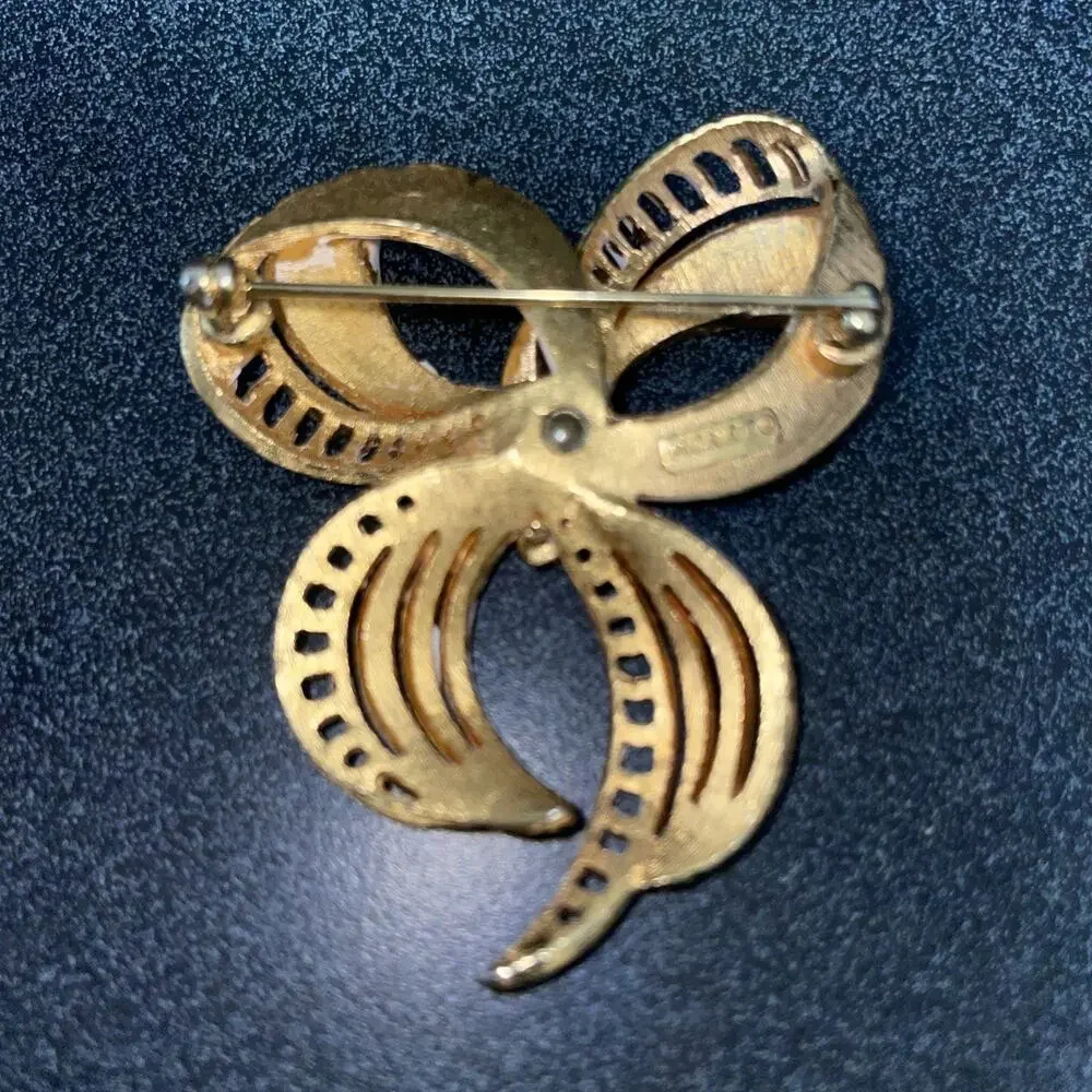Vintage MONET Gold Tone, White Enamel Fancy Bow Design Brooch Stamped